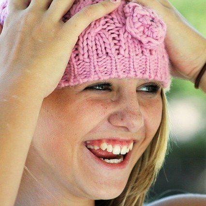 close up of happy teenage girl who just got into the college of her choice